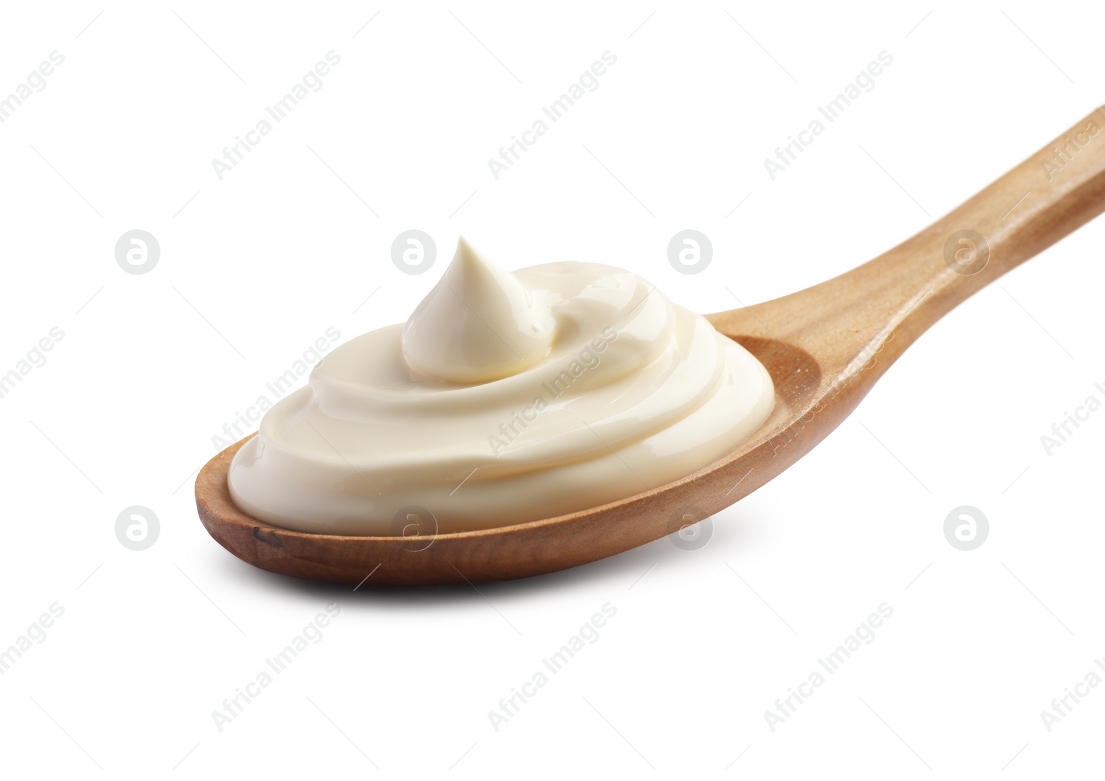 Photo of Natural yogurt in wooden spoon isolated on white