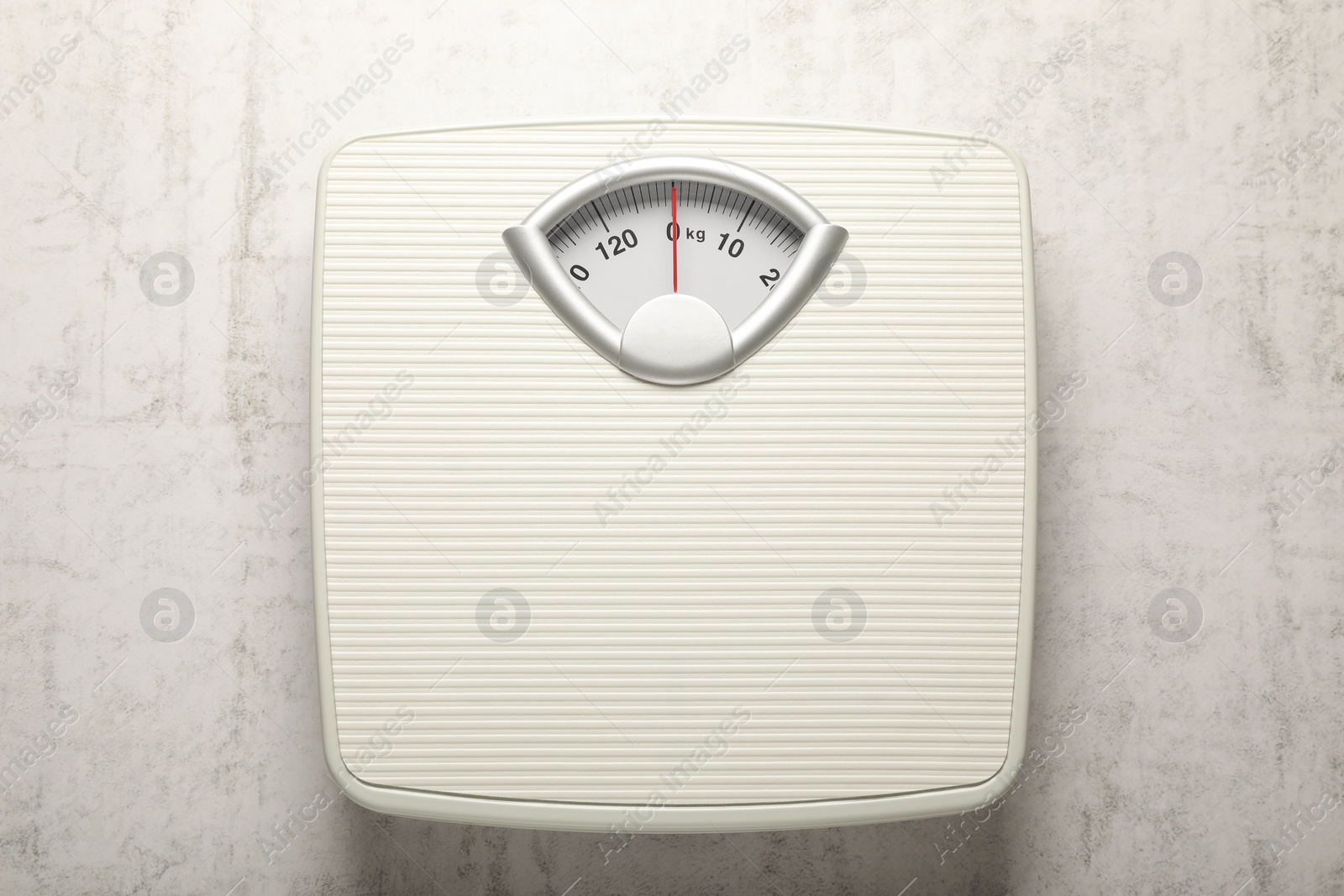 Photo of Weigh scales on white textured background, top view. Overweight concept