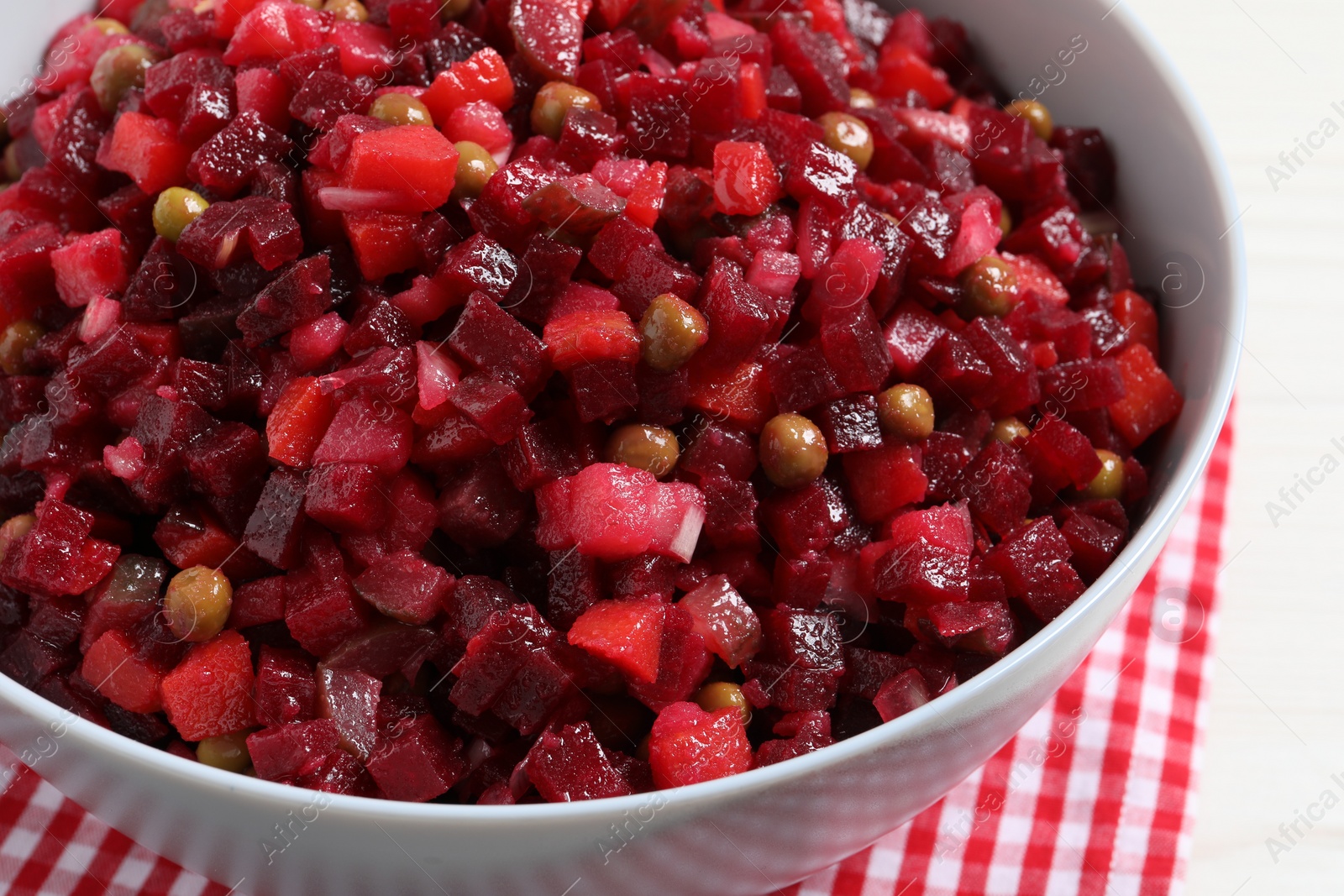 Photo of Delicious fresh vinaigrette salad on table, closeup