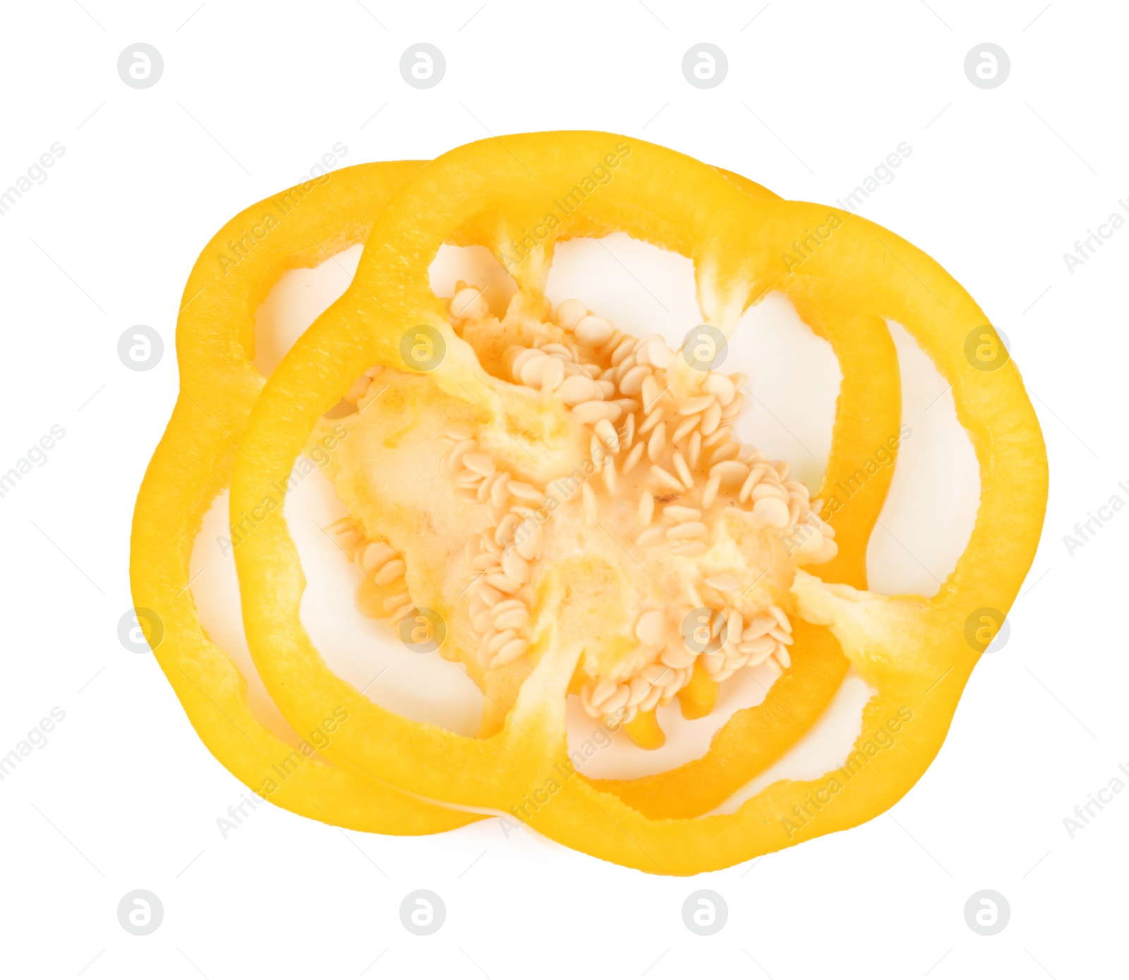 Photo of Slices of yellow bell pepper with seeds isolated on white, top view