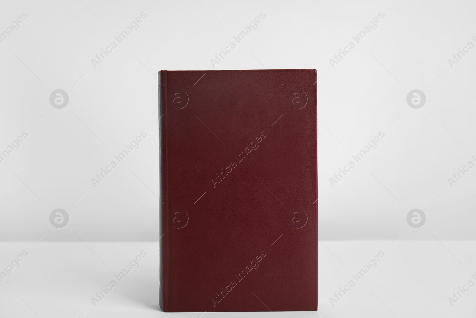 Photo of Blank book with hardcover on white background