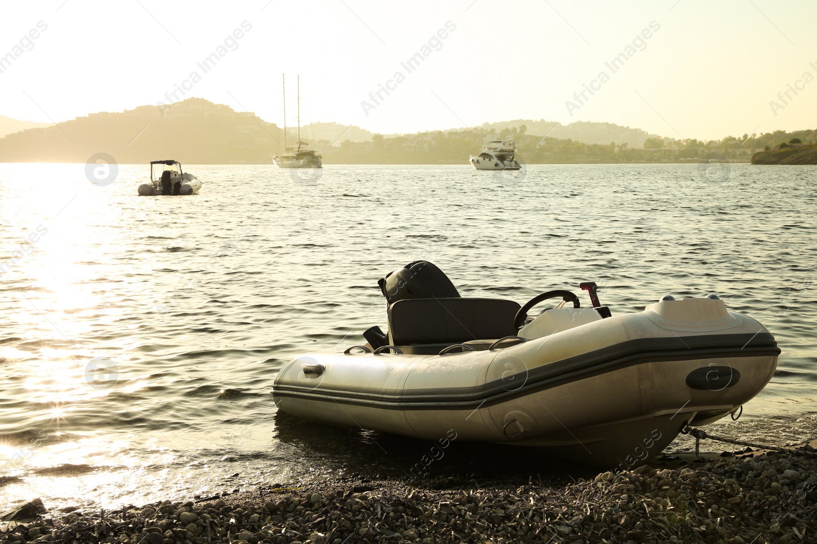 Photo of Beautiful view of calm sea, boats and coastal city on sunny day