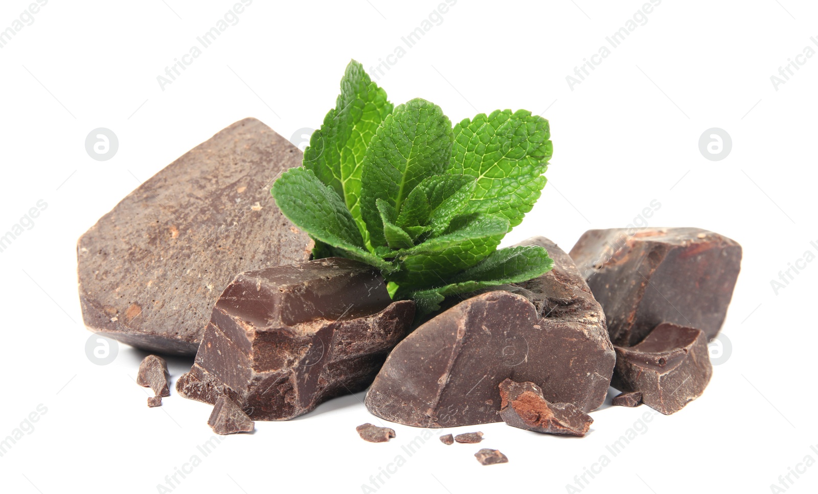 Photo of Tasty dark chocolate pieces with mint on white background