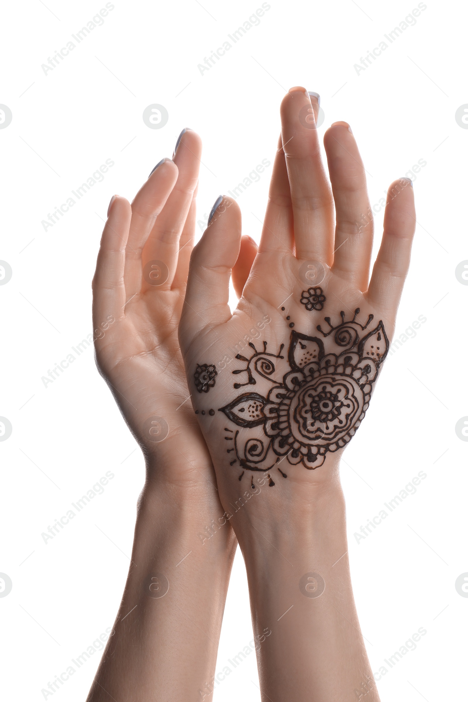 Photo of Woman with henna tattoo on palm against white background, closeup. Traditional mehndi ornament