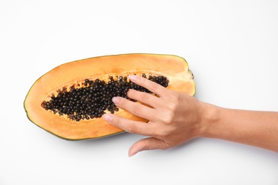 Photo of Young woman touching half of papaya on white background, top view. Sex concept