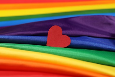 Heart on rainbow LGBT flag, closeup view