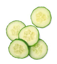 Photo of Pile of fresh cut cucumber isolated on white, top view