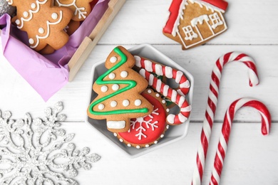 Photo of Bowl with tasty homemade Christmas cookies on table, top view