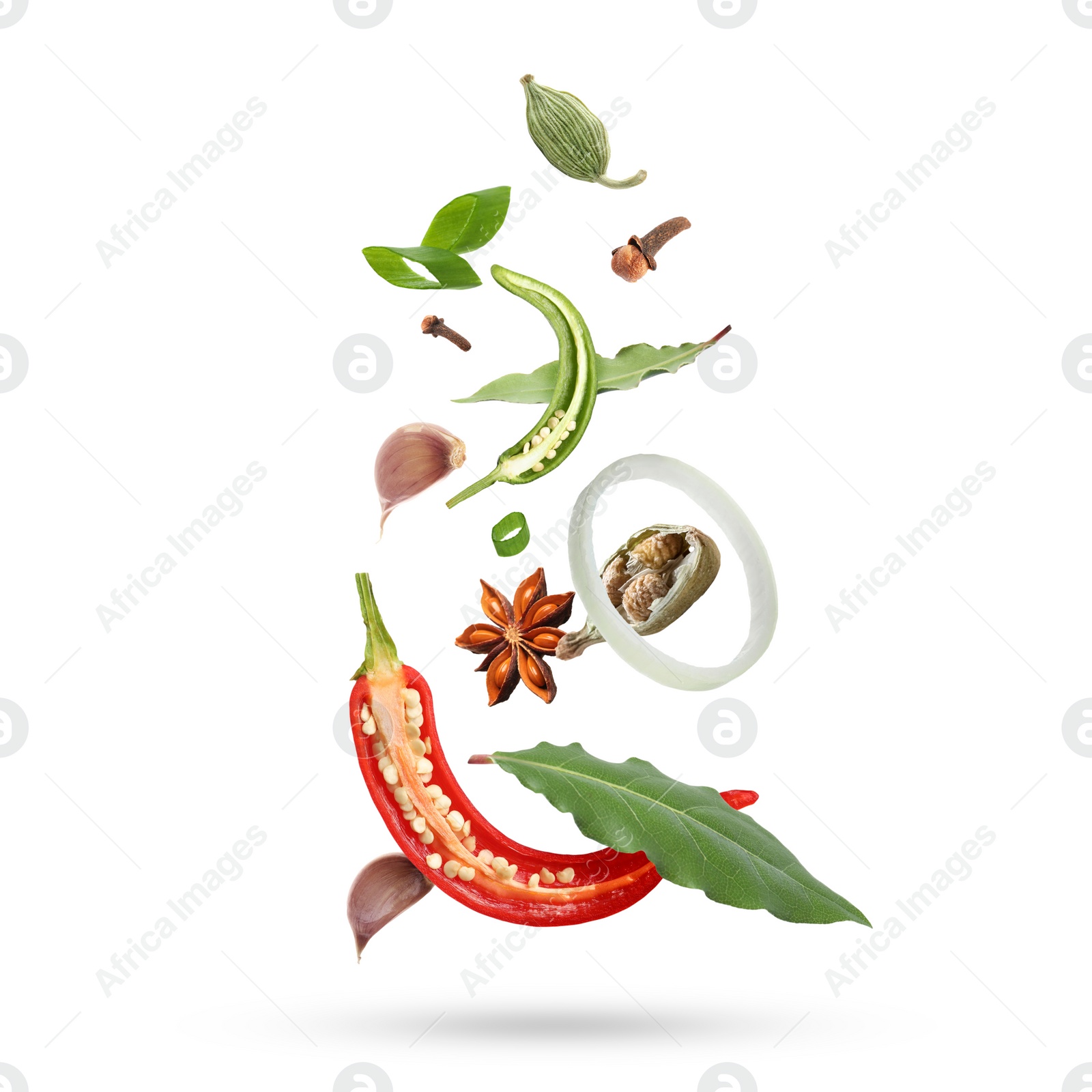 Image of Different aromatic spices falling on white background