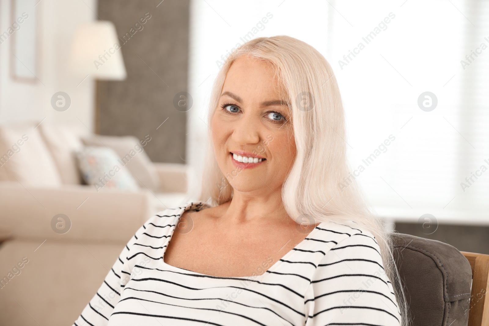 Photo of Portrait of mature woman with beautiful face indoors