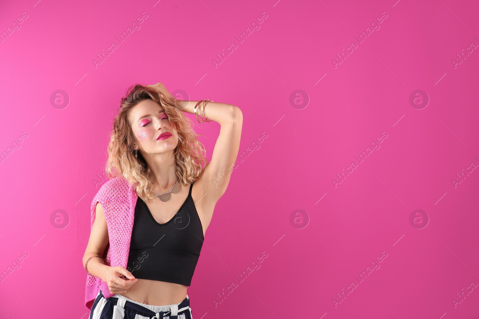 Photo of Beautiful young woman posing on color background. Summer fashion