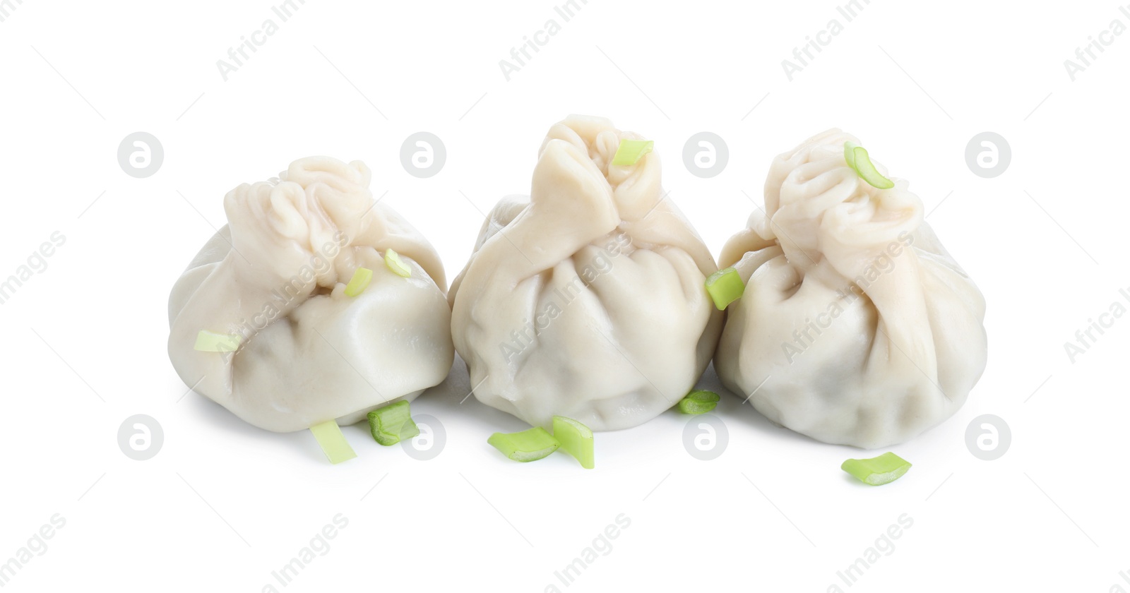 Photo of Three tasty khinkali (dumplings) and onion isolated on white. Georgian cuisine
