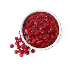 Photo of Cranberry sauce in bowl and fresh berries isolated on white, top view