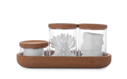 Glass jars with cotton pads and swabs in tray on white background