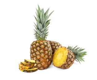 Image of Cut and whole pineapples isolated on white