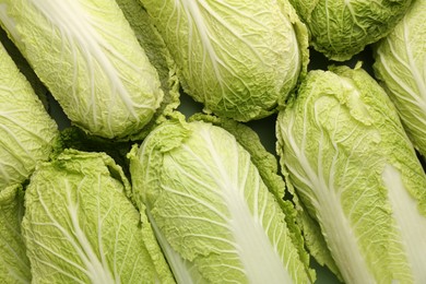 Photo of Fresh ripe Chinese cabbages as background, top view