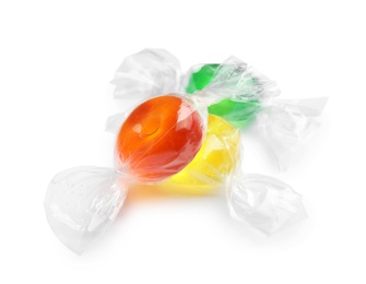 Different delicious colorful candies on white background