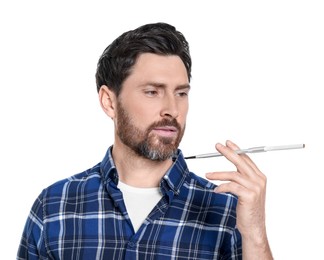 Photo of Man using long cigarette holder for smoking isolated on white