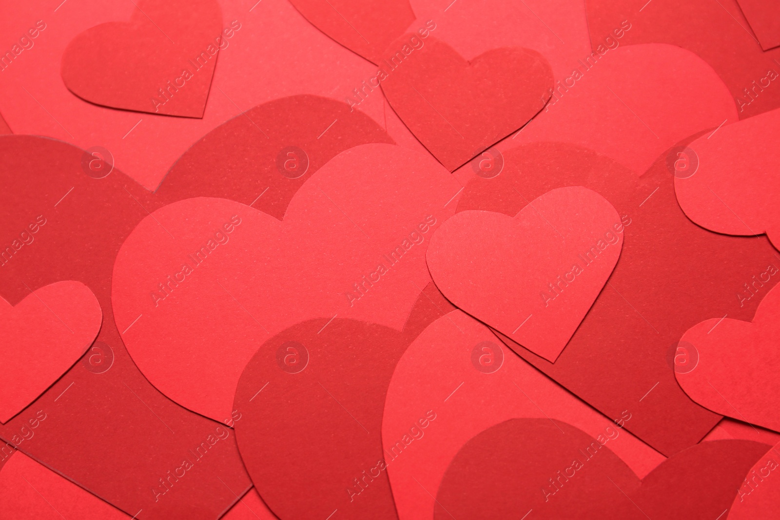 Photo of Red paper hearts as background, above view