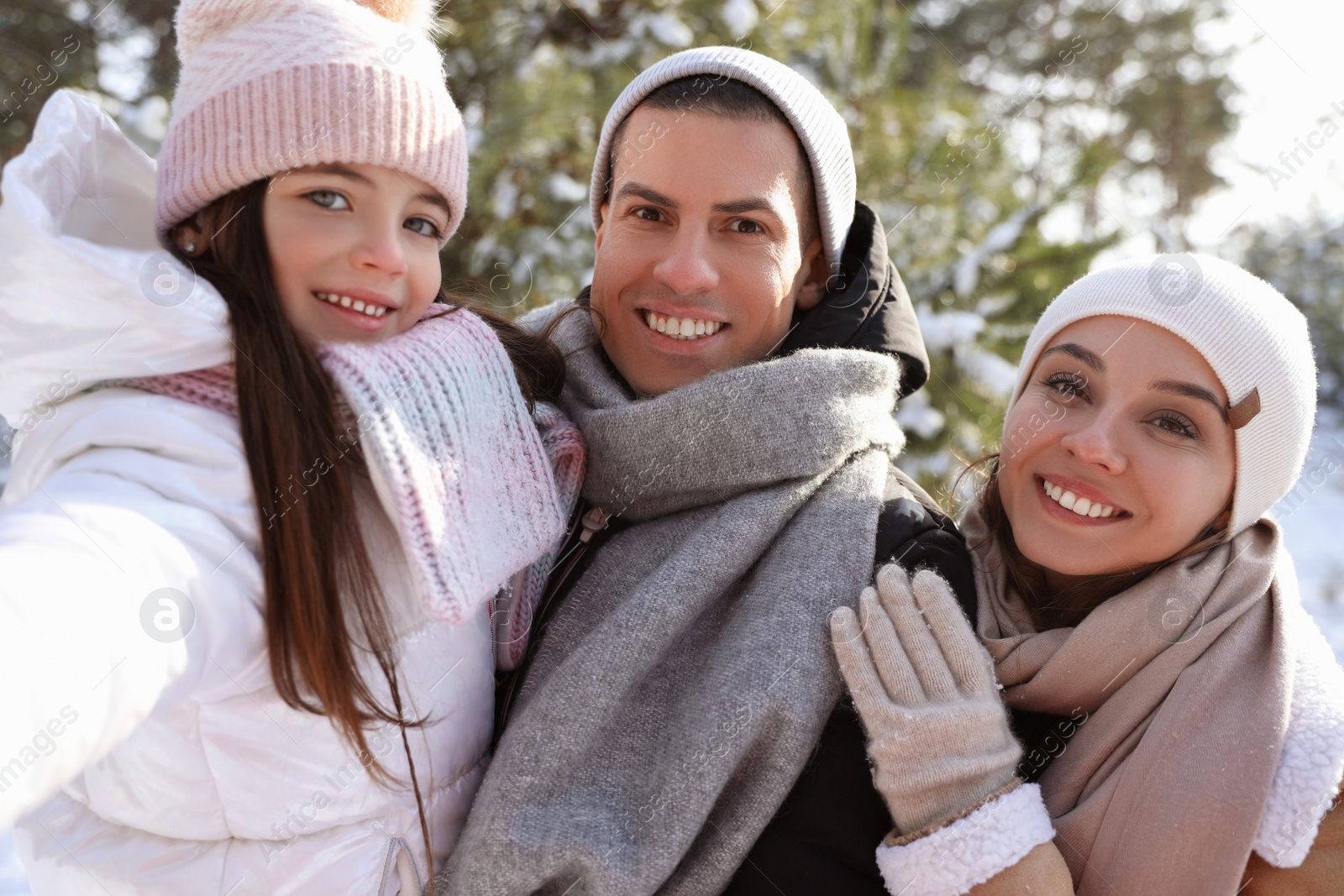 Photo of Happy family outdoors on winter day. Christmas vacation