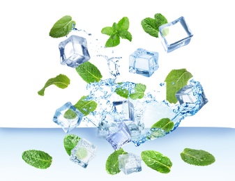 Image of Ice cubes and green mint leaves falling into water on white background