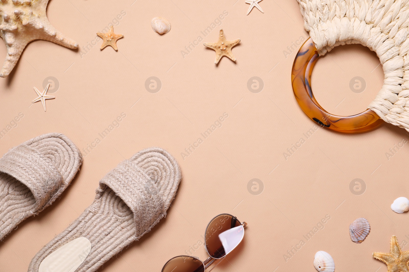 Photo of Flat lay composition with summer objects on beige background. Space for text