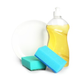 Detergent, plate and sponges on light background, space for text. Clean dishes