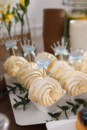 Photo of Tasty treats on table in room. Sweet buffet