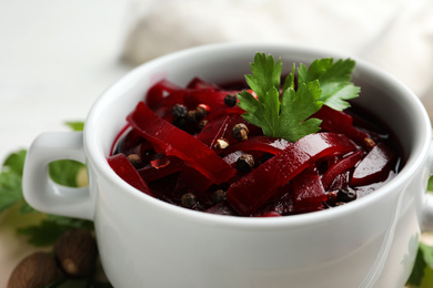 Photo of Delicious pickled beets in bowl, closeup view