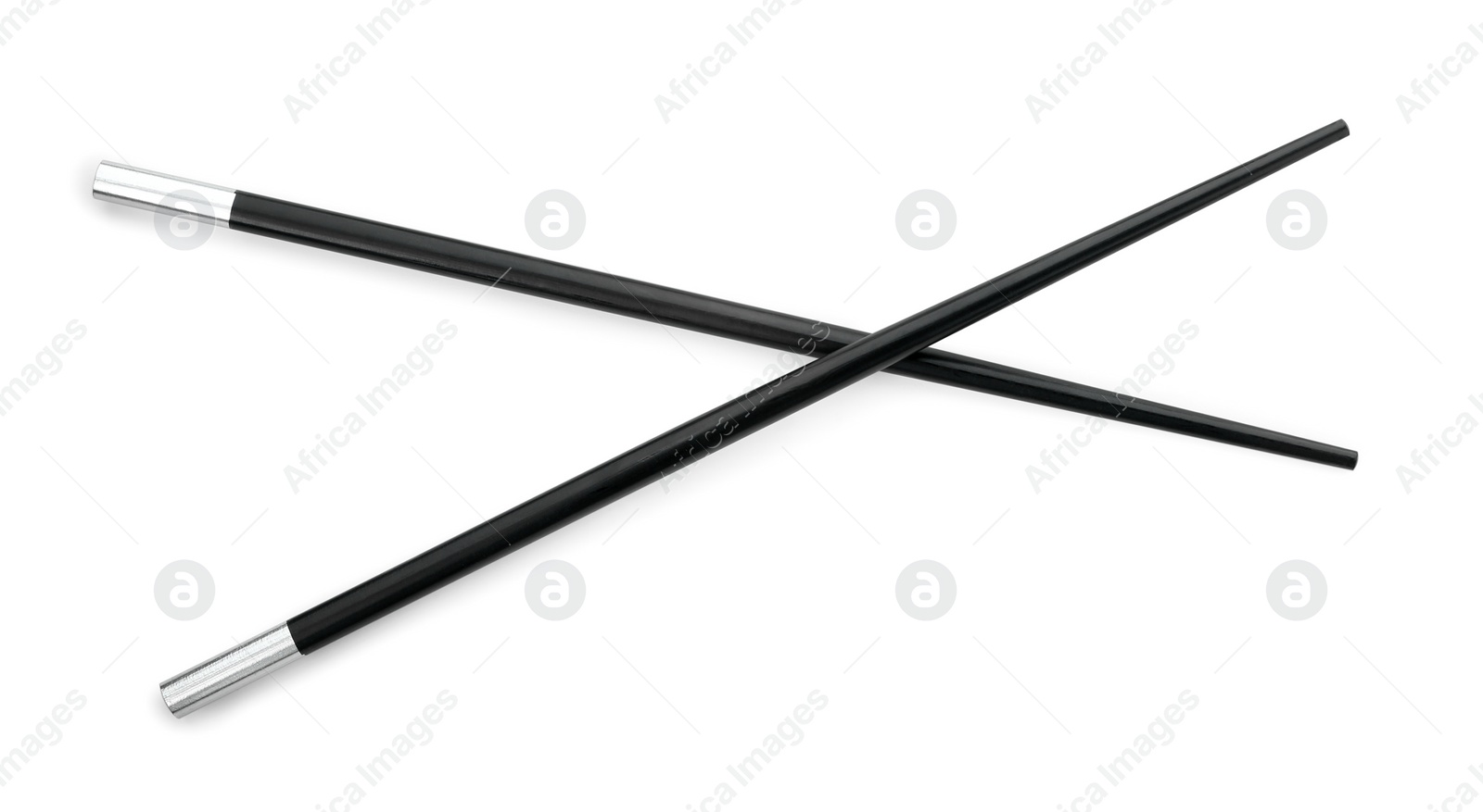 Photo of Pair of black chopsticks isolated on white, top view