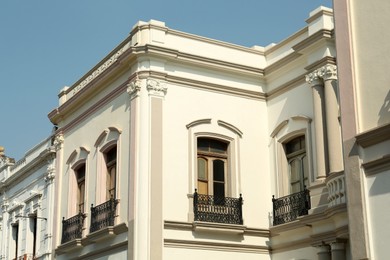 Photo of Exterior of beautiful building with windows and balconies