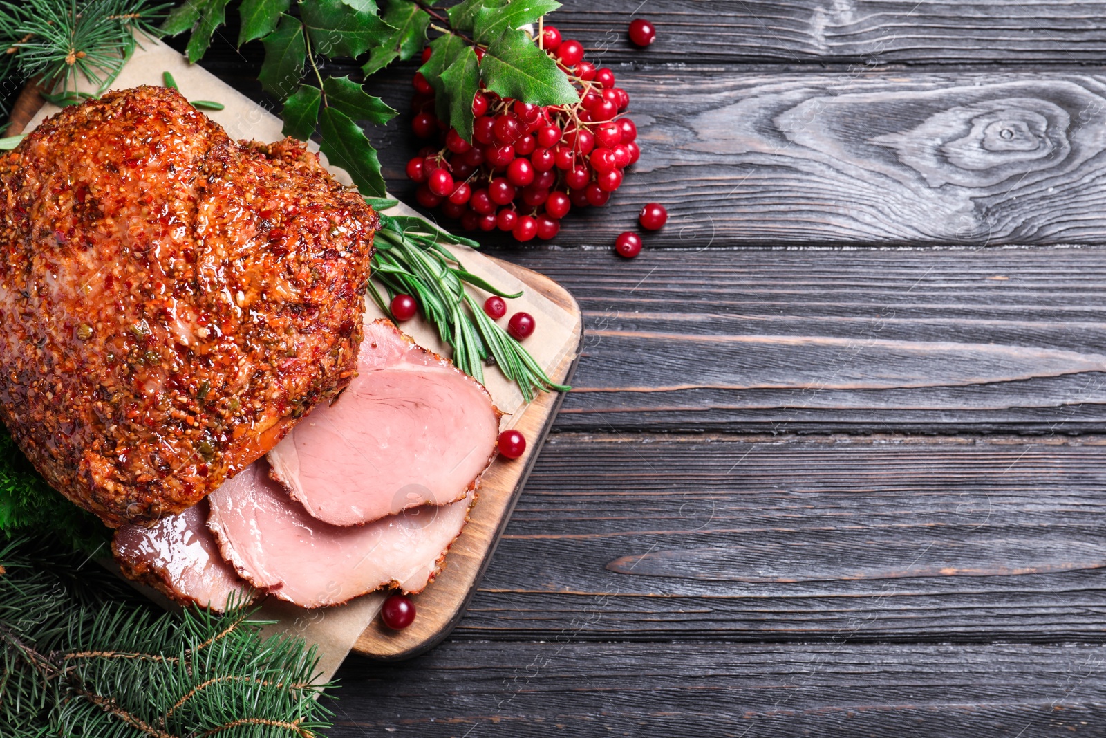 Photo of Homemade delicious ham on grey wooden background, flat lay with space for text. Festive dinner