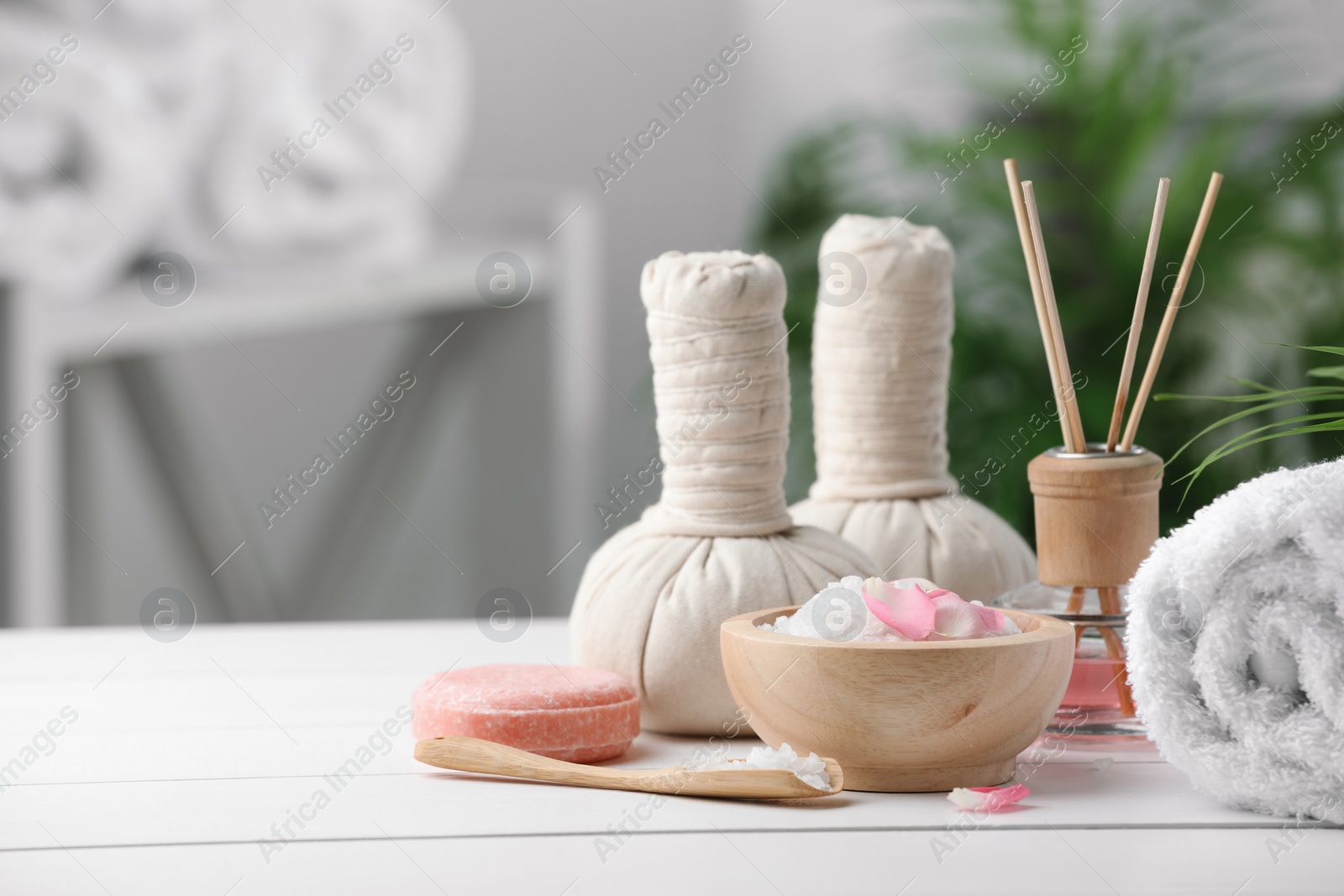 Photo of Beautiful composition with different spa products on white table against blurred background. Space for text