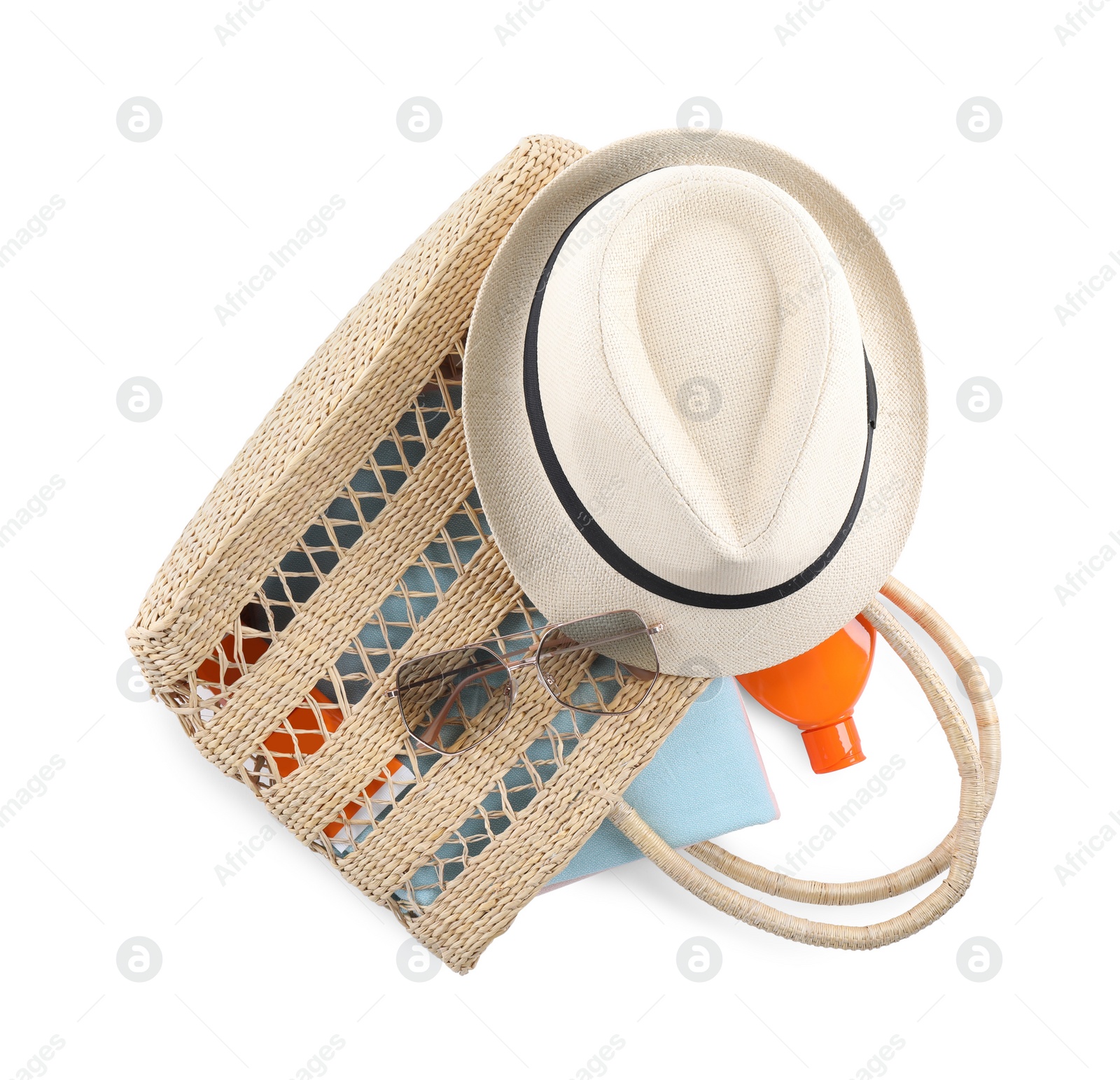 Photo of Bag with beach objects on white background, top view