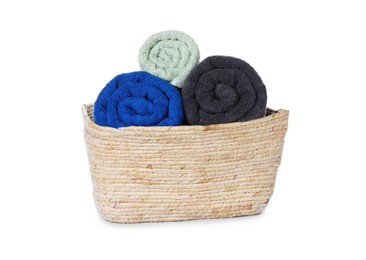 Fresh clean towels in wicker basket on white background