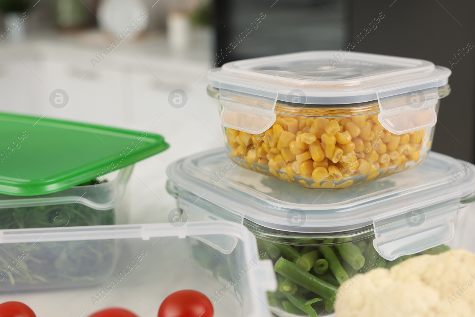 Photo of Containers with fresh products on table, closeup. Food storage