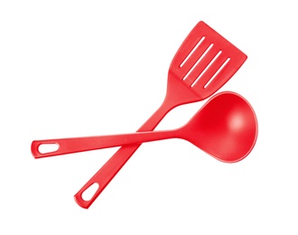 Photo of Slotted spatula and soup ladle on white background