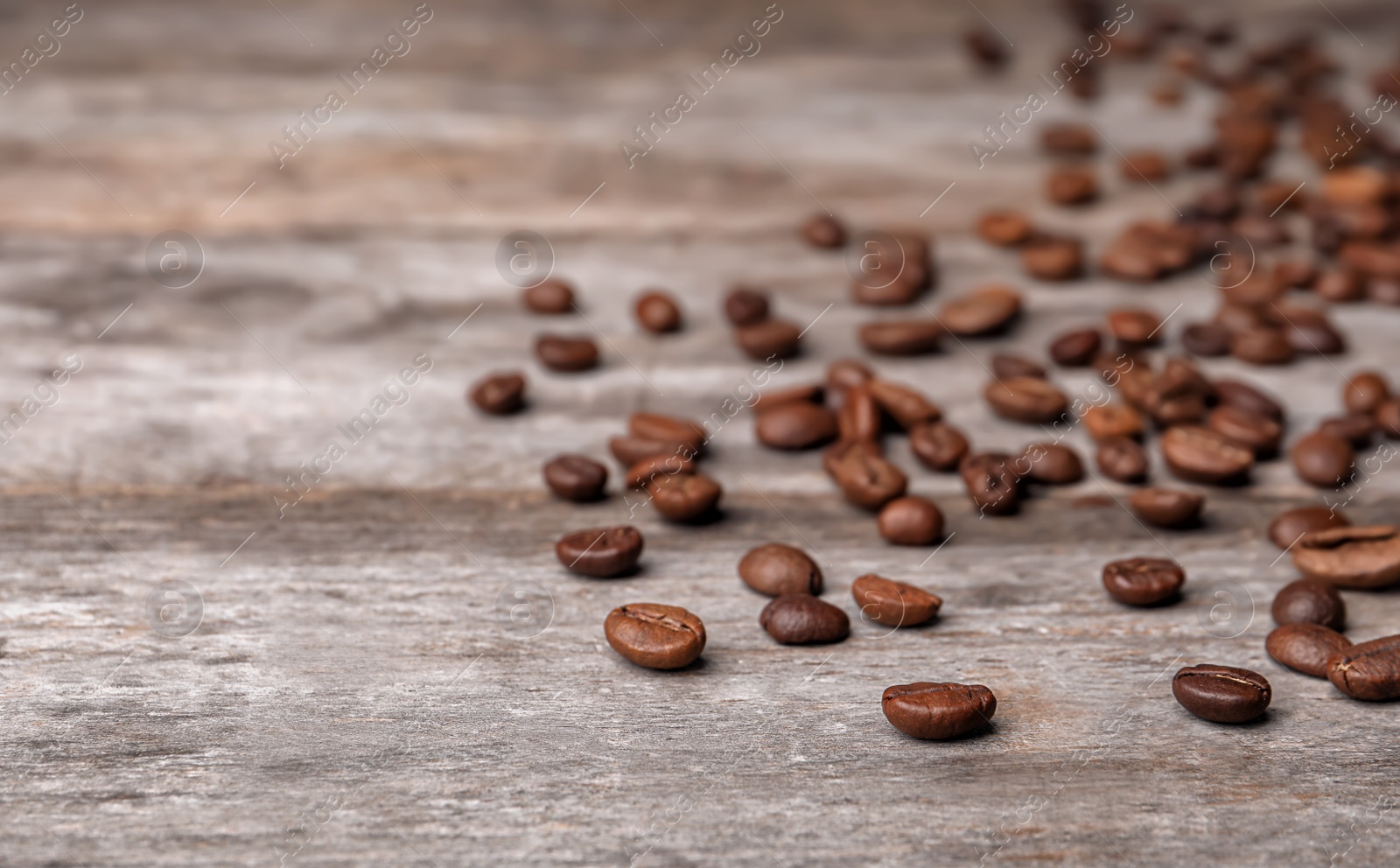 Photo of Coffee beans on wooden table