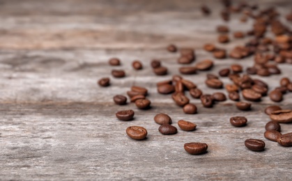 Coffee beans on wooden table