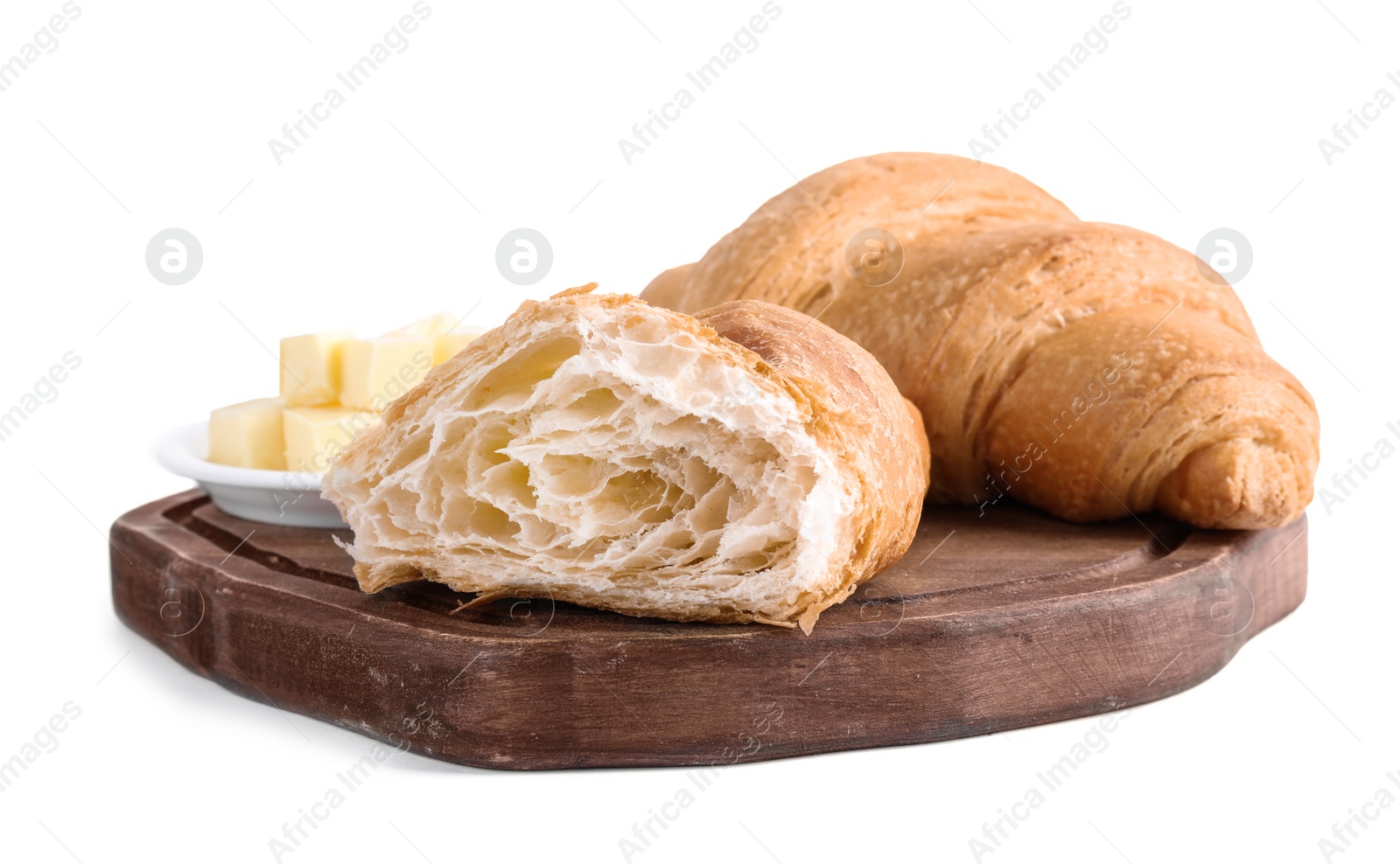 Photo of Tasty fresh croissants with butter on white background