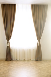 Photo of Window with elegant curtains in modern room