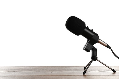 Microphone on table against white background. Space for text