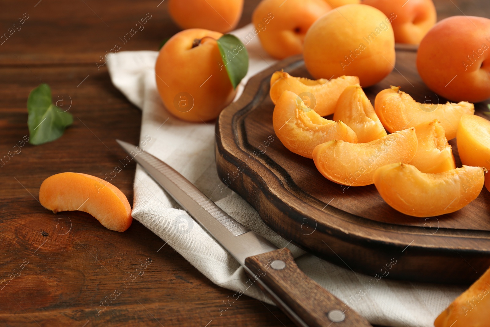 Photo of Composition with delicious ripe sweet apricots on wooden table, space for text