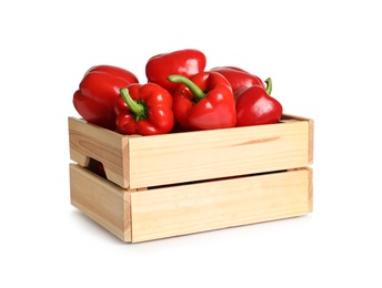 Wooden crate with tasty bell peppers on white background