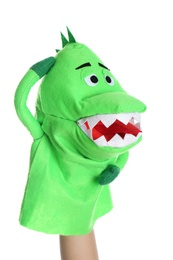 Photo of Dinosaur puppet for show on hand against white background