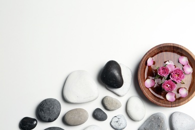 Photo of Flat lay composition with spa stones and space for text on white background