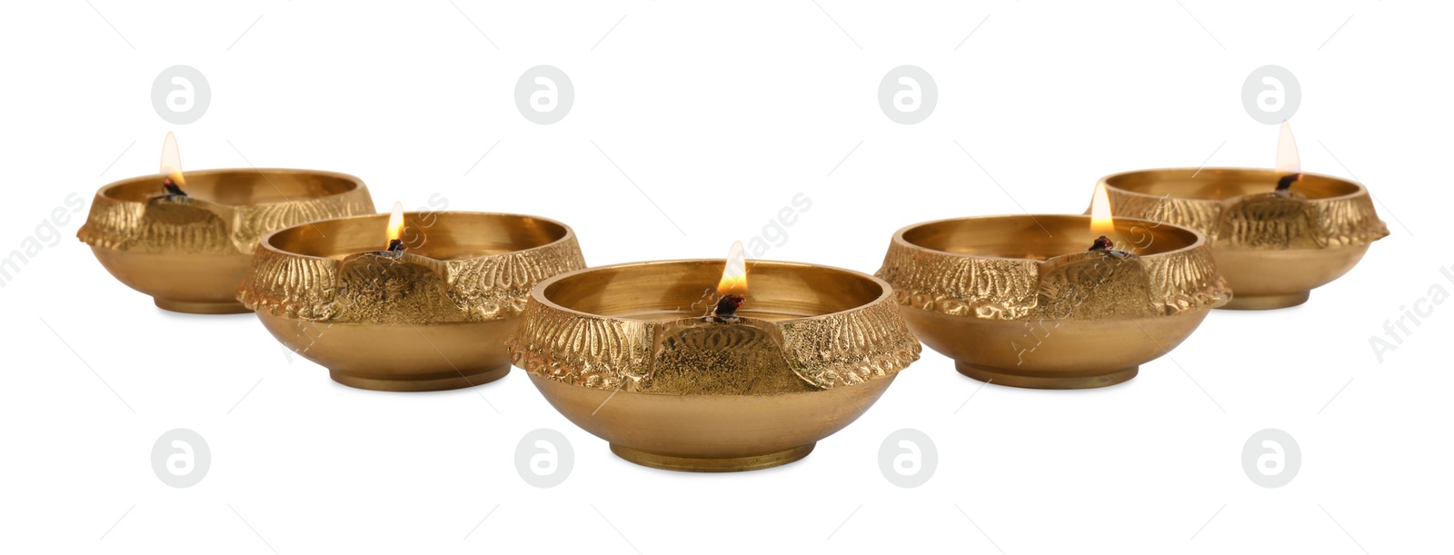 Photo of Lit diya lamps on white background. Diwali celebration