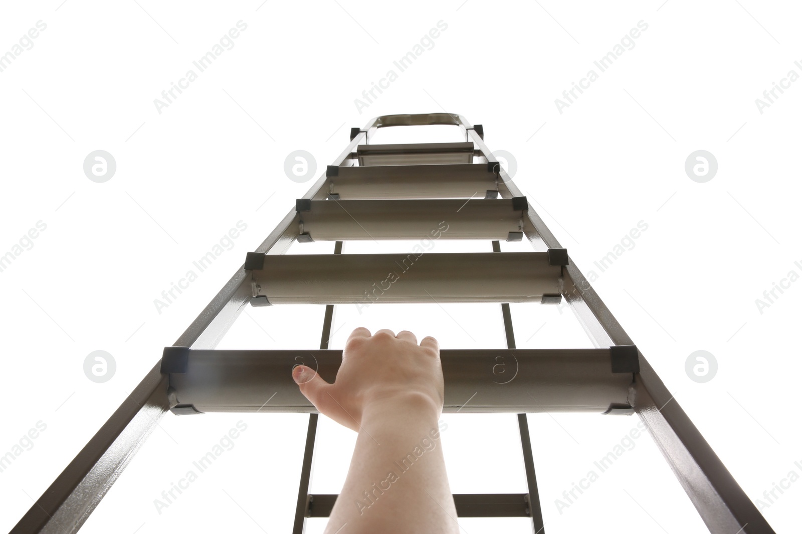 Photo of Woman climbing up stepladder on white background, low angle view