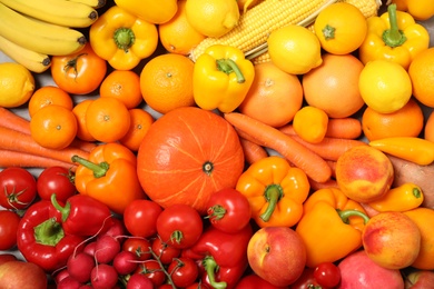 Photo of Assortment of organic fresh fruits and vegetables as background, closeup