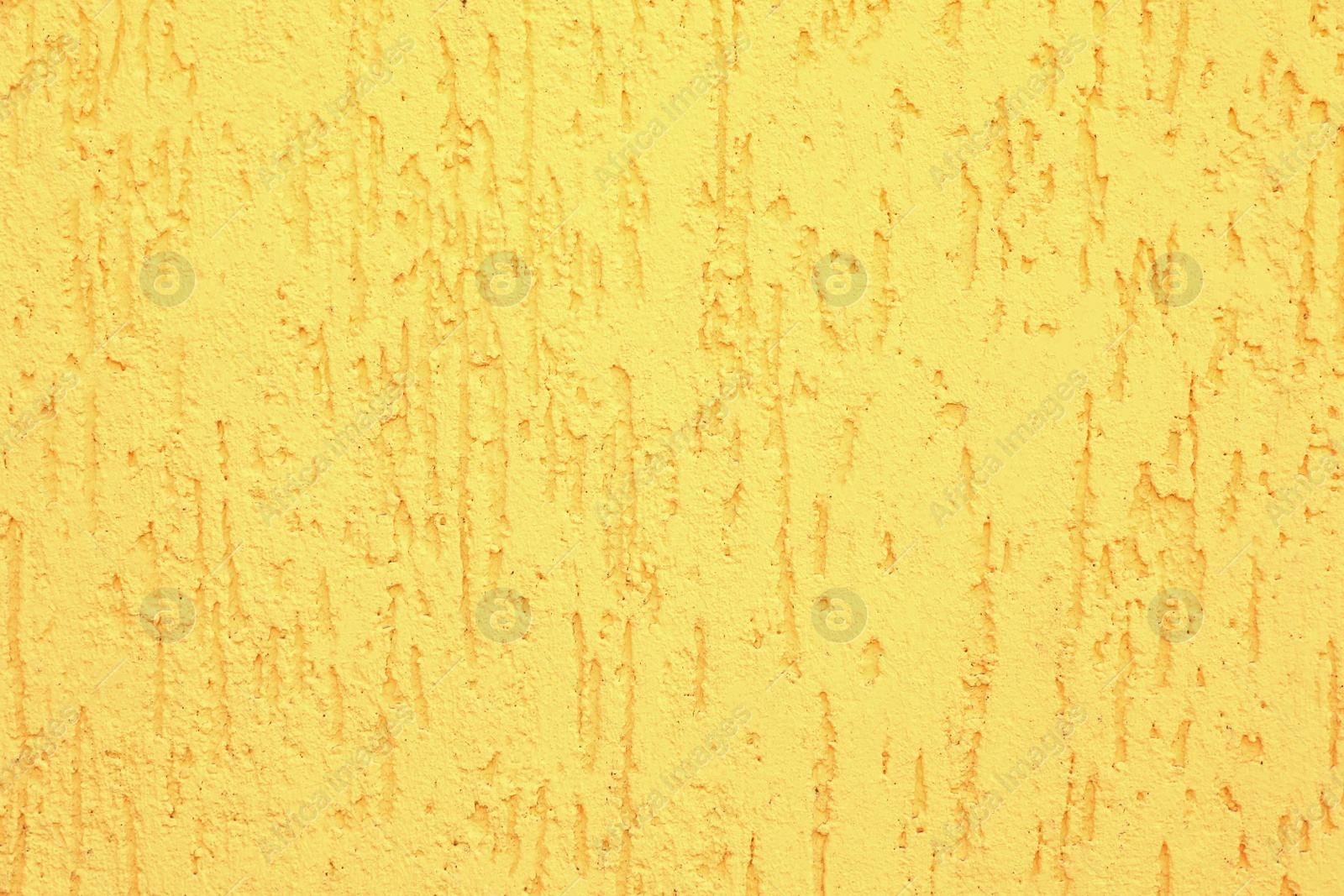 Photo of Texture of yellow plaster wall as background